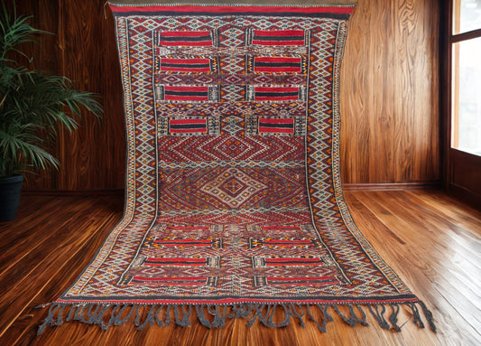 Decorative rug with intricate patterns on a wooden floor