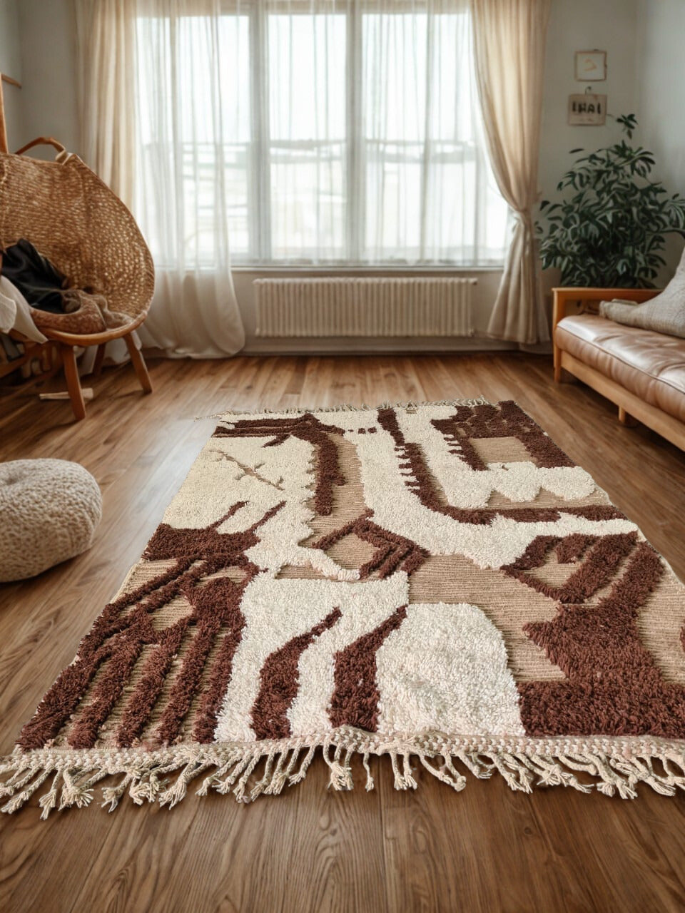 Decorative rug with geometric pattern on a wooden floor in a room with a window and furniture.