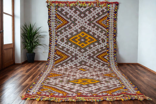 Decorative rug with geometric pattern on a wooden floor