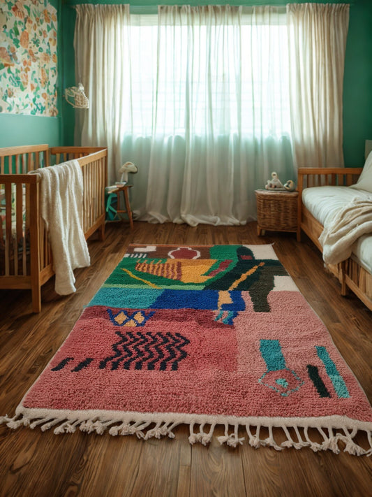 Colorful rug with abstract design on a wooden floor in a room with green walls and white curtains.
