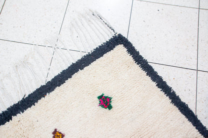 Azilal Ivory Field with Sprig Motifs — Charcoal Border