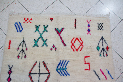 Azilal Glyph Scatter — Ivory Field with Multicolor Signs