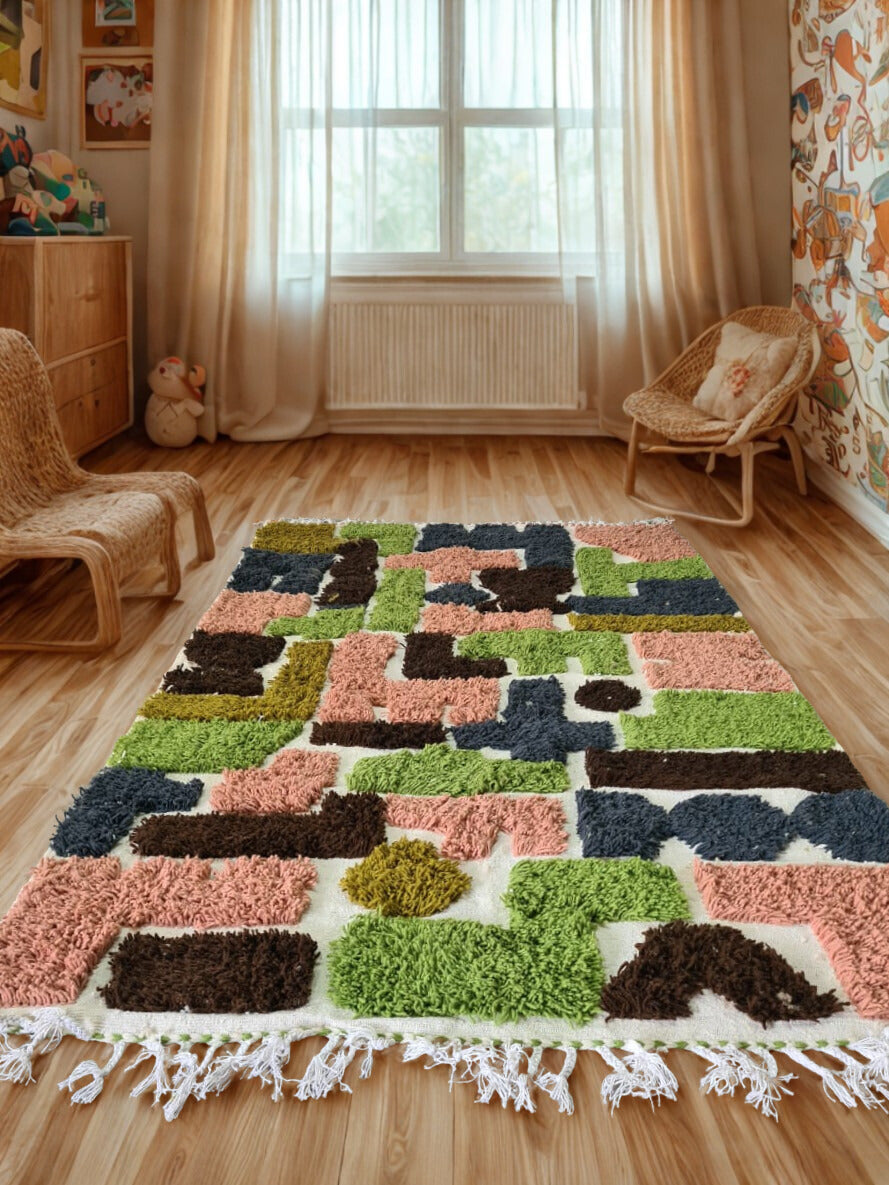 Colorful geometric-patterned rug on a wooden floor with wicker furniture and curtains in the background.