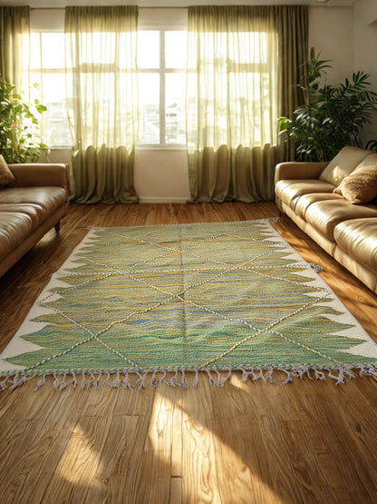 Living room with a green and white patterned rug, beige sofa, and green curtains.