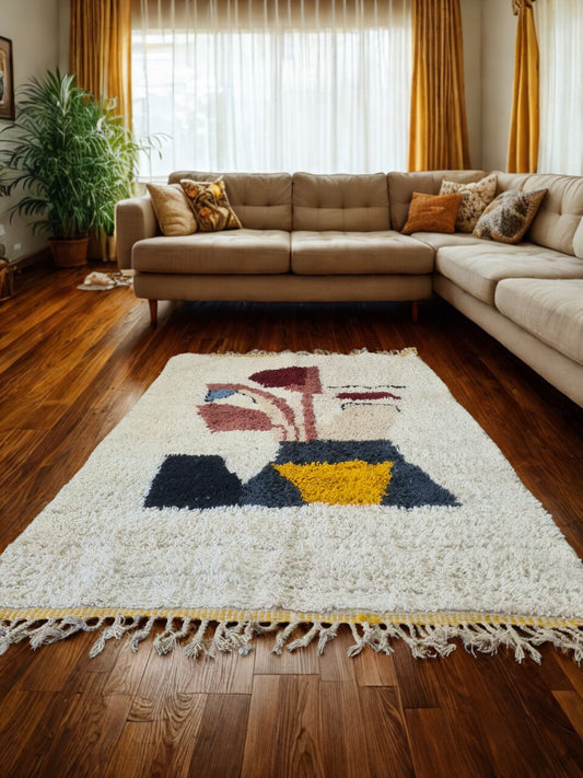 Beige sectional sofa with decorative pillows on a colorful area rug in a living room.